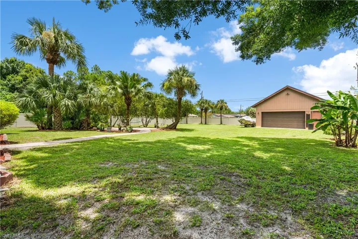 View of yard with a garage