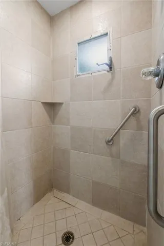 3/3 Side: Full bathroom with tiled shower