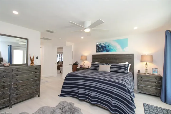 Bedroom featuring ceiling fan and light wood-type flooring