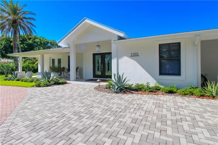 Property entrance with a porch and french doors