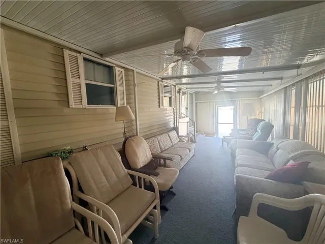 Sunroom / solarium featuring an outdoor hangout area and a ceiling fan