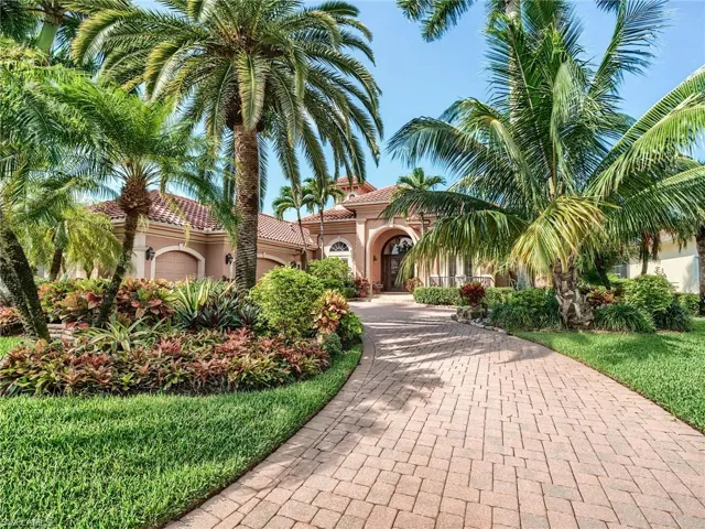 Mediterranean / spanish-style home with a garage
