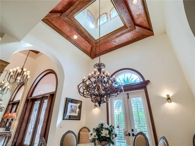Interior details with a notable chandelier and french doors