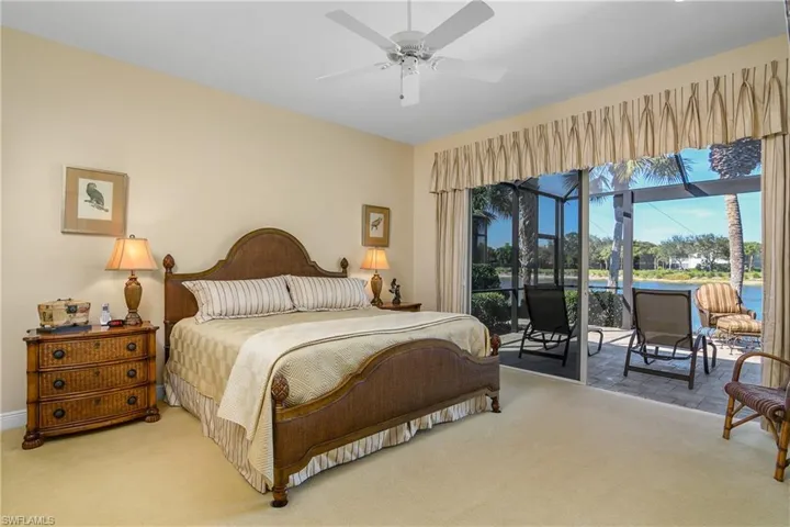Large master bedroom with open slider wall to lanai