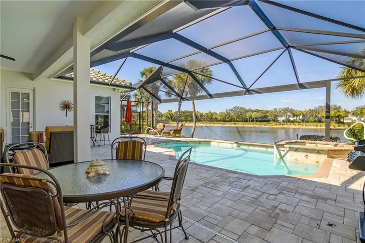 Pool, deck and spa with plenty of sun and constant shade for relaxation or enjoying food and beverages. Door to left goes to master bedroom suite.