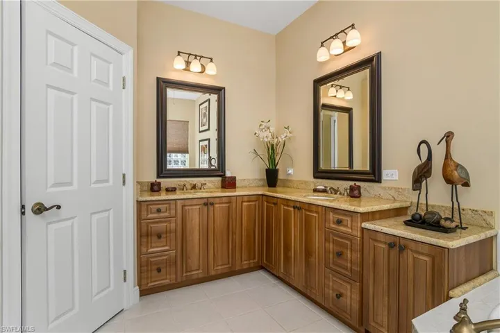 Master bath dual sinks and cabinets, left door to water closet