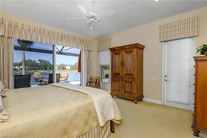 The enlarged lanai wraps around the master bedroom suite...entry to lanai can be from either sliders or door with shade to right