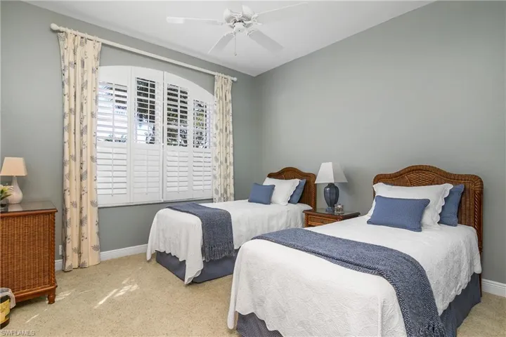 Guest bedroom, arched plantation shutters