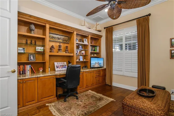 Den with built in cabinetry and closet...owner choice, can be 4th bedroom, only den or both. Wood flooring.