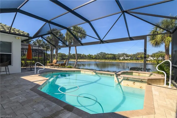 Lanai: enlarged with deck extending to master bedroom wall, natural gas heated pool and spa, picture window pool cage, automatic pool cleaner in water.