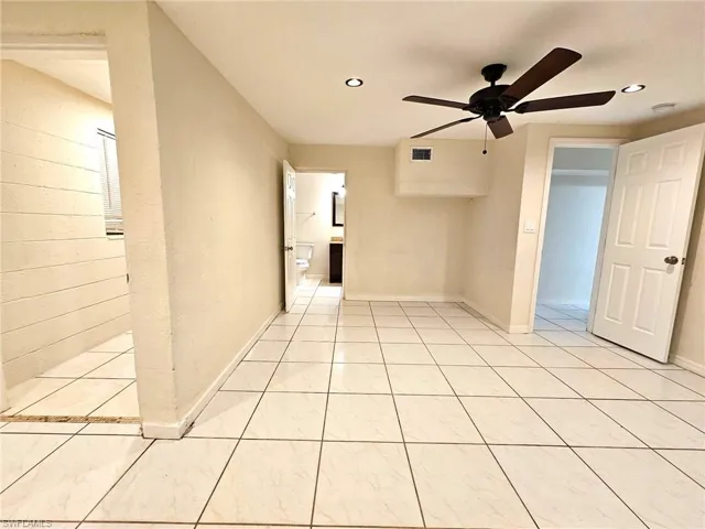 Spacious bedroom complemented by a private en-suite bathroom, delivering enhanced comfort and privacy.
