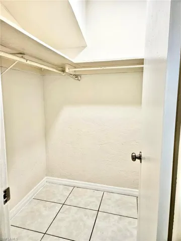 Walk in closet featuring tile patterned floors