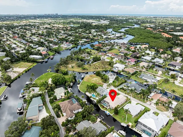 View of property location with a nearby body of water and nearby suburban area
