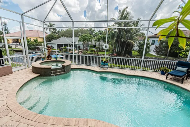 View of swimming pool with a lanai and a sunroom