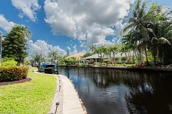 Water view of canal and boat dock/lift
