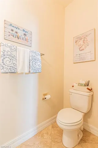 Bathroom featuring baseboards and tile patterned flooring