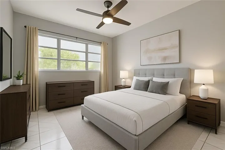 Bedroom with ceiling fan and light tile patterned floors