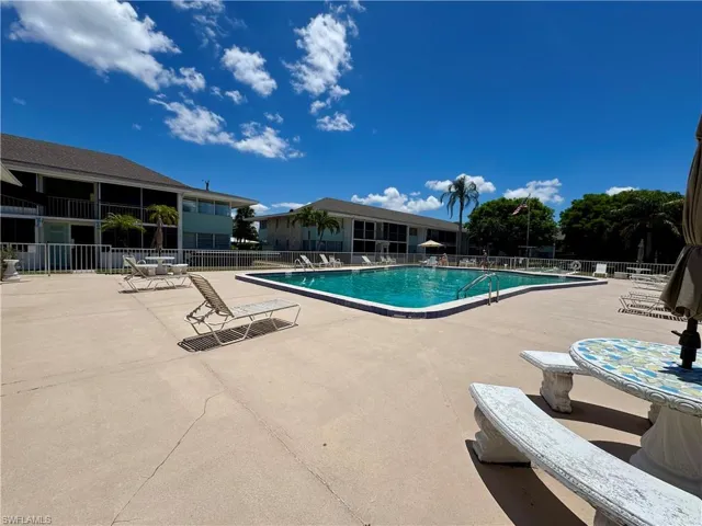 Community pool featuring a patio area