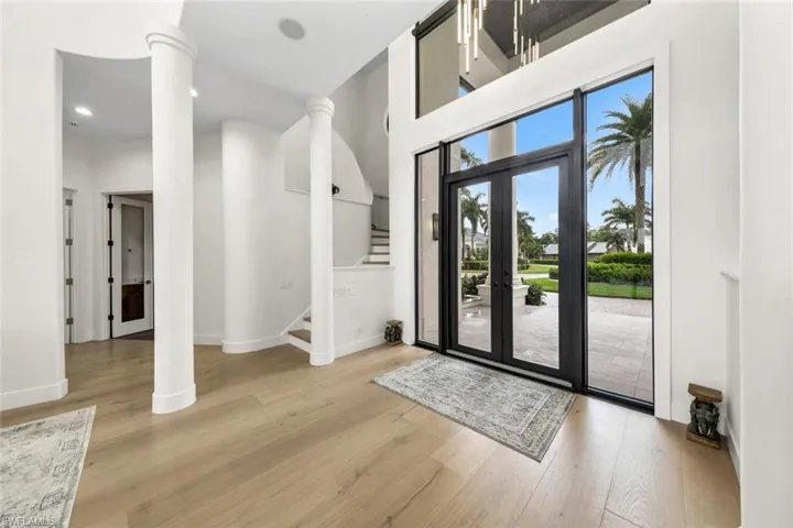 Grand entry, with 10-inch wide oak hardwood floors throughout the home