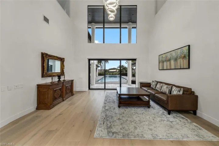Living room with soaring ceilings and pocket sliding glass doors