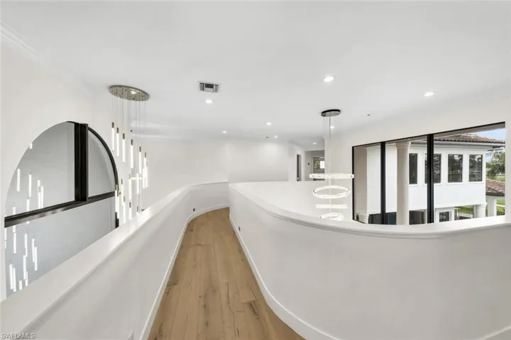 Upstairs walkway from en-suite guest bedroom, to other guest bedrooms and loft/game room.