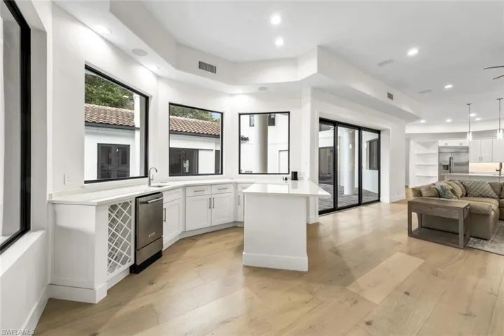 Wet bar with sink,  icemaker and wine cooler
