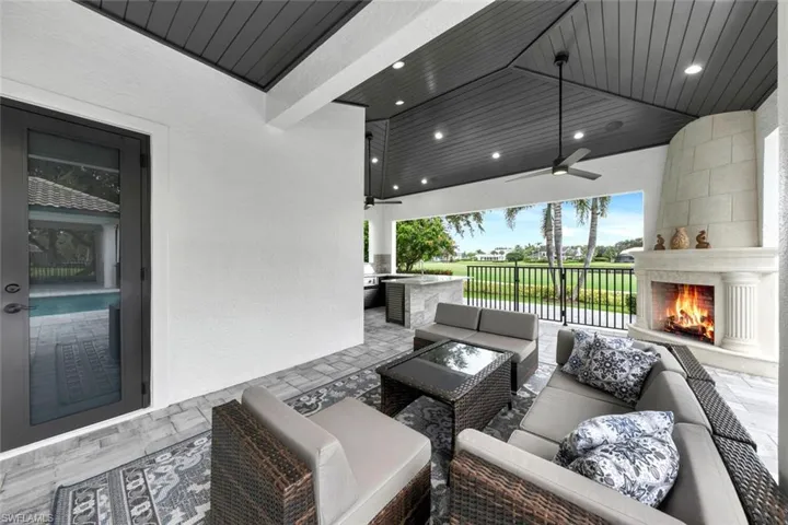 Outdoor under cover patio with gas and wood-burning fireplace