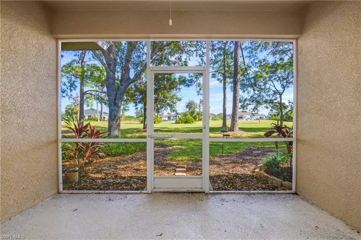 sunroom featuring a golf course view