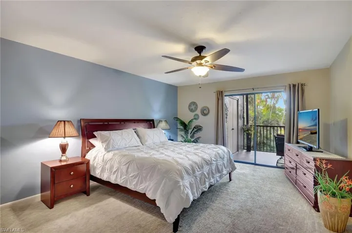 Main bedroom featuring access to the lanai and lots of natural light