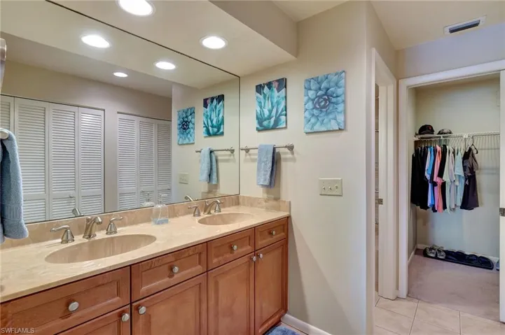 Bathroom with tile flooring and double vanity