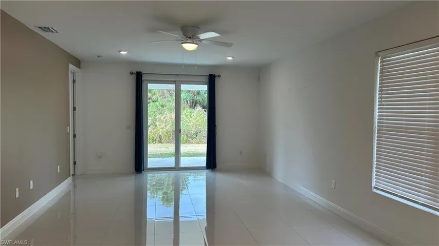 Spare room featuring a ceiling fan, light tile patterned floors, and recessed lighting