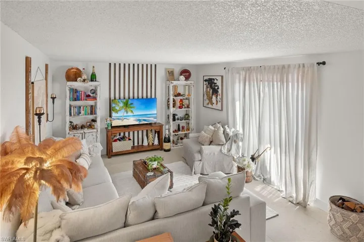 Living area featuring a textured ceiling