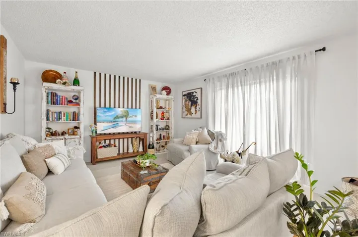 Living area featuring a textured ceiling