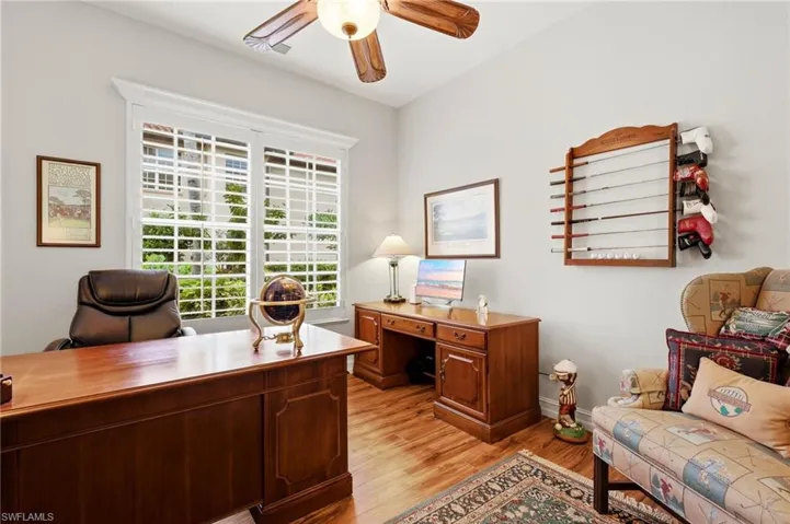 The office or den is a bright, versatile space, ideal for keeping up with emails or daily tasks, bathed in natural light. This room can easily be transformed into an elegant formal dining room.