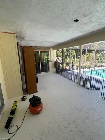 View of patio / terrace with a lanai