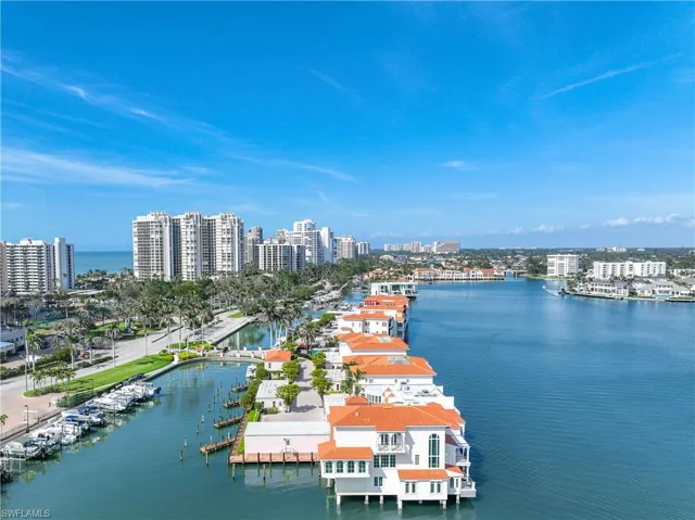 North facing aerial view of Venetian Villas with The Village Shops on Venetian Bay in the distance