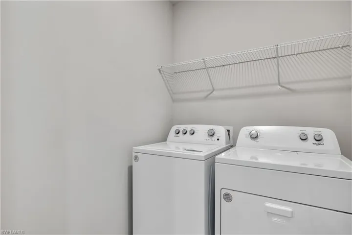 Laundry area featuring independent washer and dryer