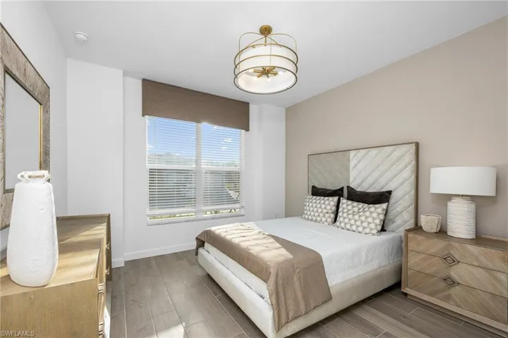 Bedroom featuring wood finish floors and baseboards