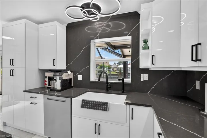 Soft close cabinetry, custom lighting/plumbing fixtures. Large Farmhouse Sink.