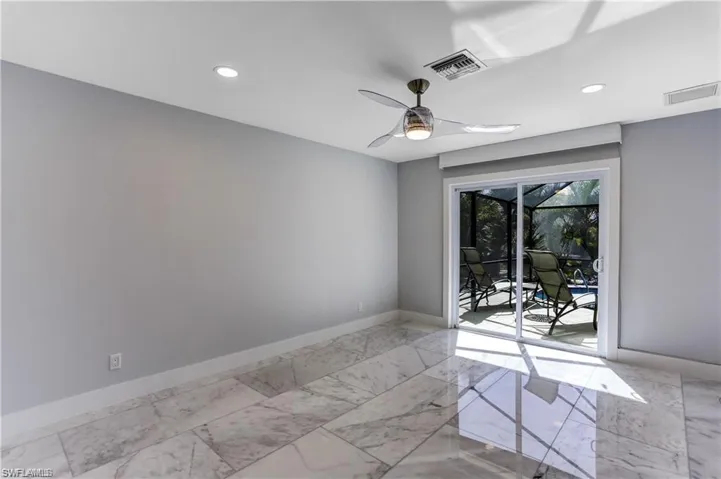 Sliders out to the lanai from Primary Bedroom. Pfiefer/Somfy electric shades.