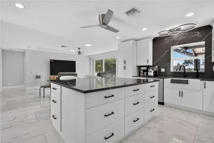 Kitchen opens up to the Great Room. Marble tile throughout the home.