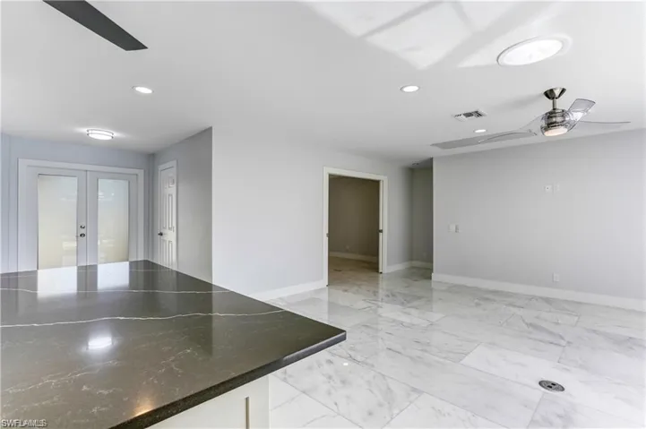 Kitchen opens up to the Great Room, Sliders out to lanai from Great Room.