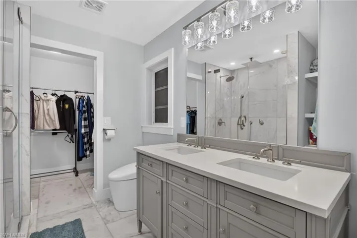 Dual sink vanity, quartz counters. Toto bidet toilet, new lighting, plumbing, and electrical fixtures.