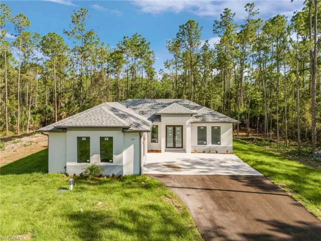 View of front of property with a front yard