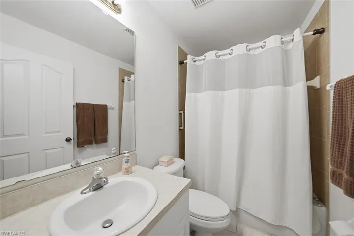 Full bathroom with vanity and shower / tub combo