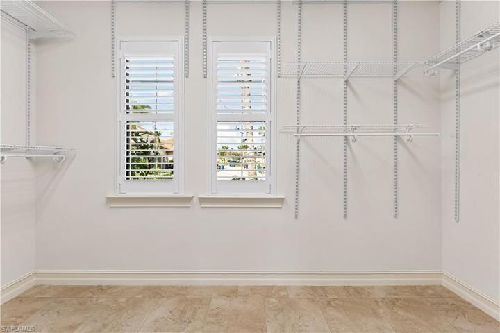 ENORMOUS WALK IN CLOSET IN MASTER SUITE.