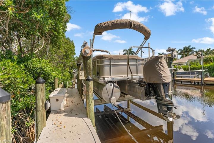 40 foot lighted dock with 14,250 lb. rated lift with auto stop.The pontoon boat is also for sale for a separate purchase.