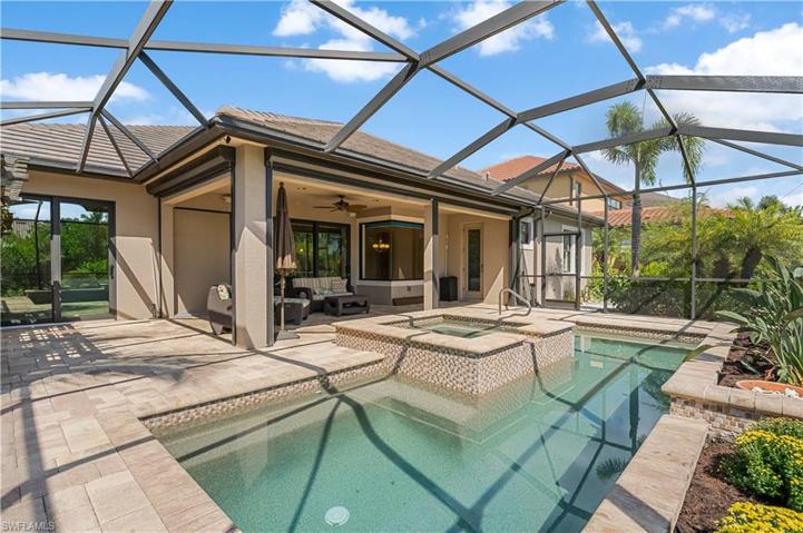 Storm Smart power hurricane shades for piece of mind! Heated salt water pool and spa! Pavered deck.