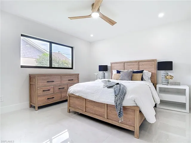 Bedroom featuring a ceiling fan, recessed lighting, and baseboards