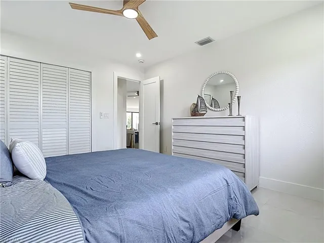 Bedroom featuring baseboards, ceiling fan, and a closet